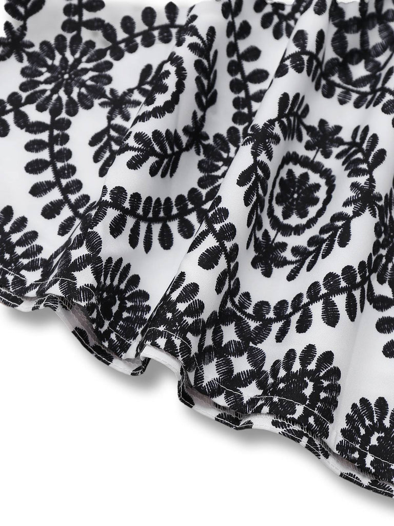 Robe noire à fleurs sans manches à revers années 1940