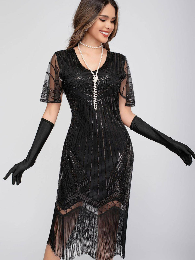 Robe Charleston à paillettes et pompons col rond années 1920