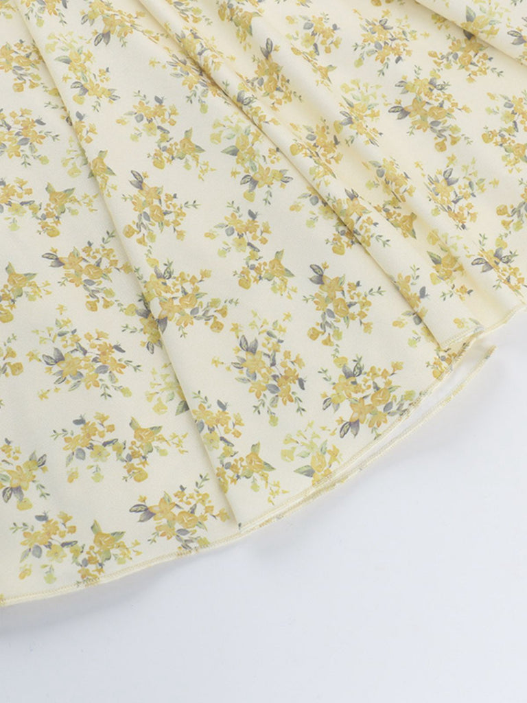 Robe jaune à fleurs et col en V manches bouffantes années 1960