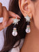 Boucles d'oreilles bonhomme de neige en strass flocons de neige et perles