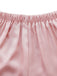 Close-up of pink fabric with a white background