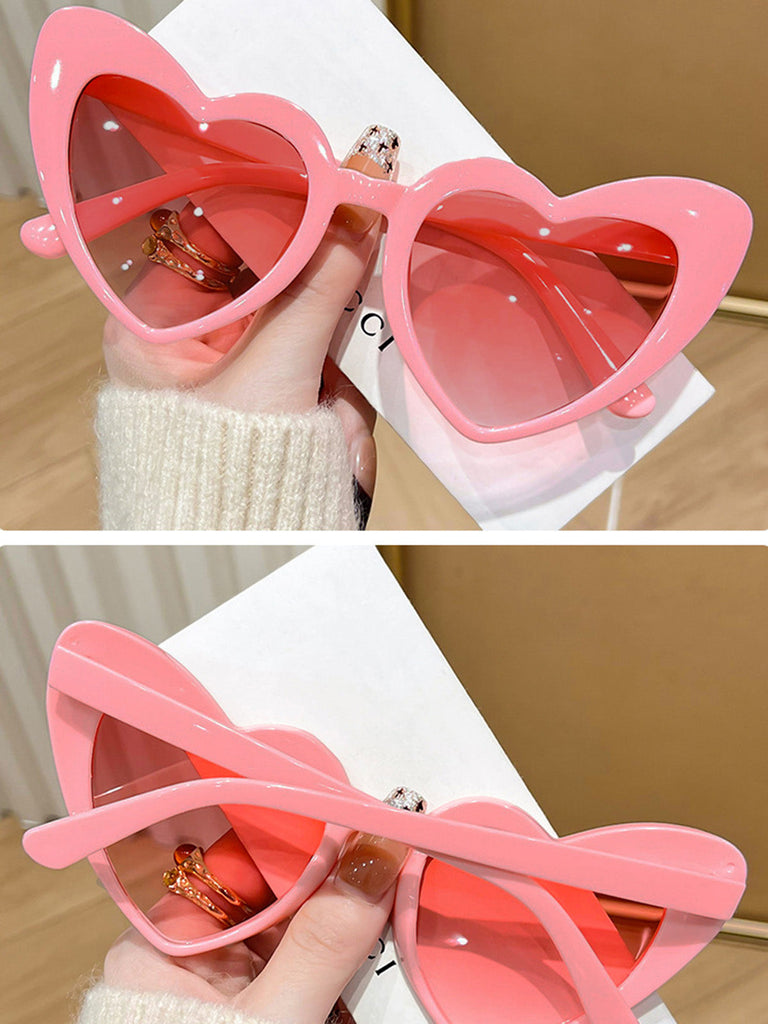 Lunettes de soleil à monture en forme de cœur incurvée