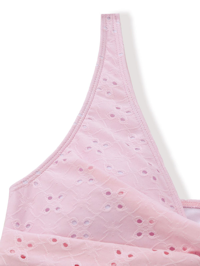 Pink bra with small floral patterns on a white background