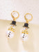 Boucles d'oreilles bonhomme de neige en strass flocons de neige et perles
