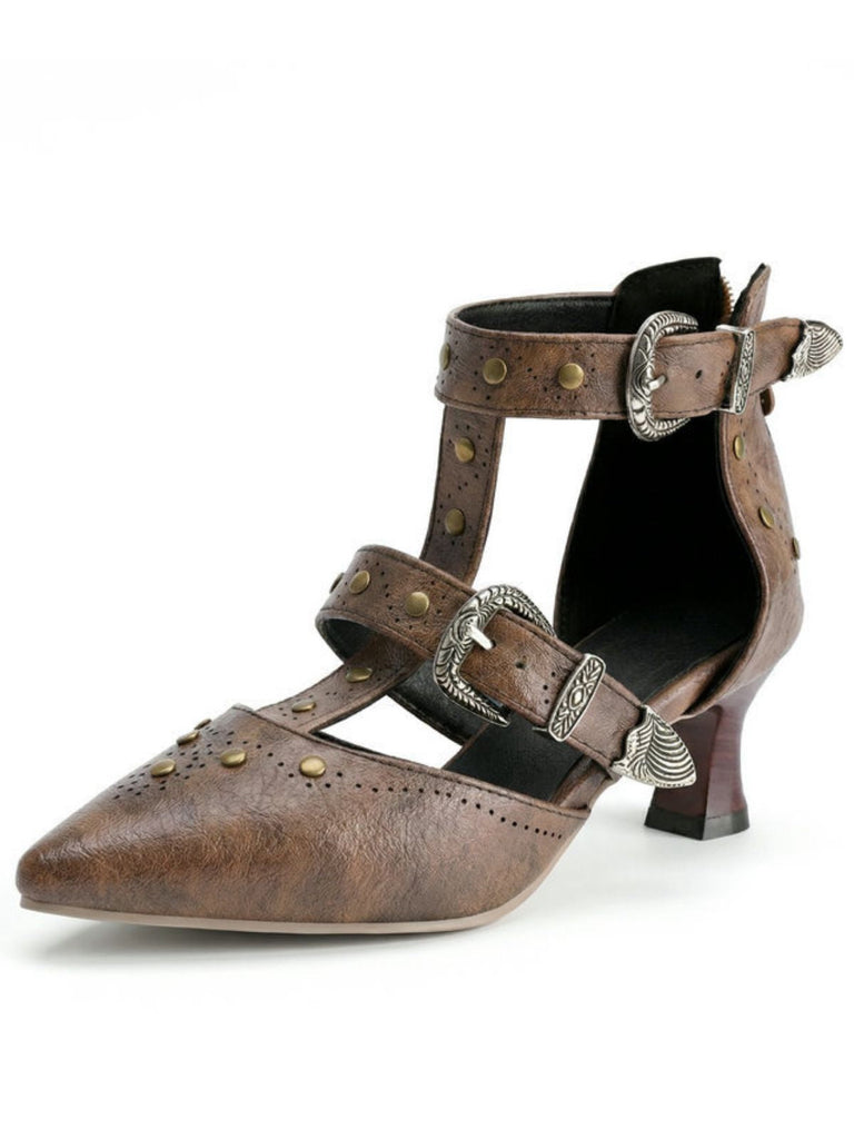 Brown leather shoe with buckles and decorative elements on a white background