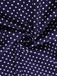 Navy blue fabric with white polka dots