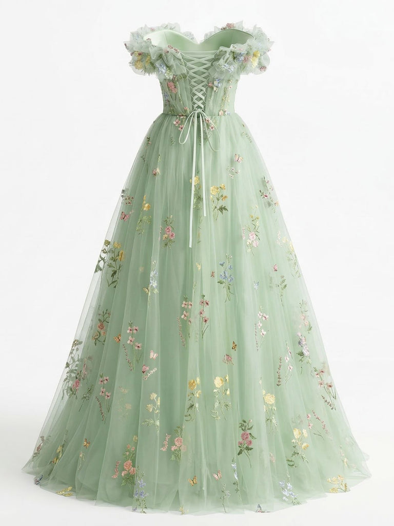 Green floral embroidered dress on a white background