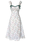 Floral dress with green straps on a white background