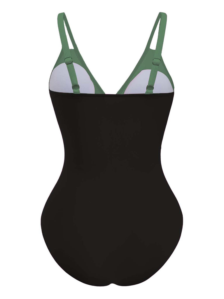 Black swimsuit with green straps on a white background