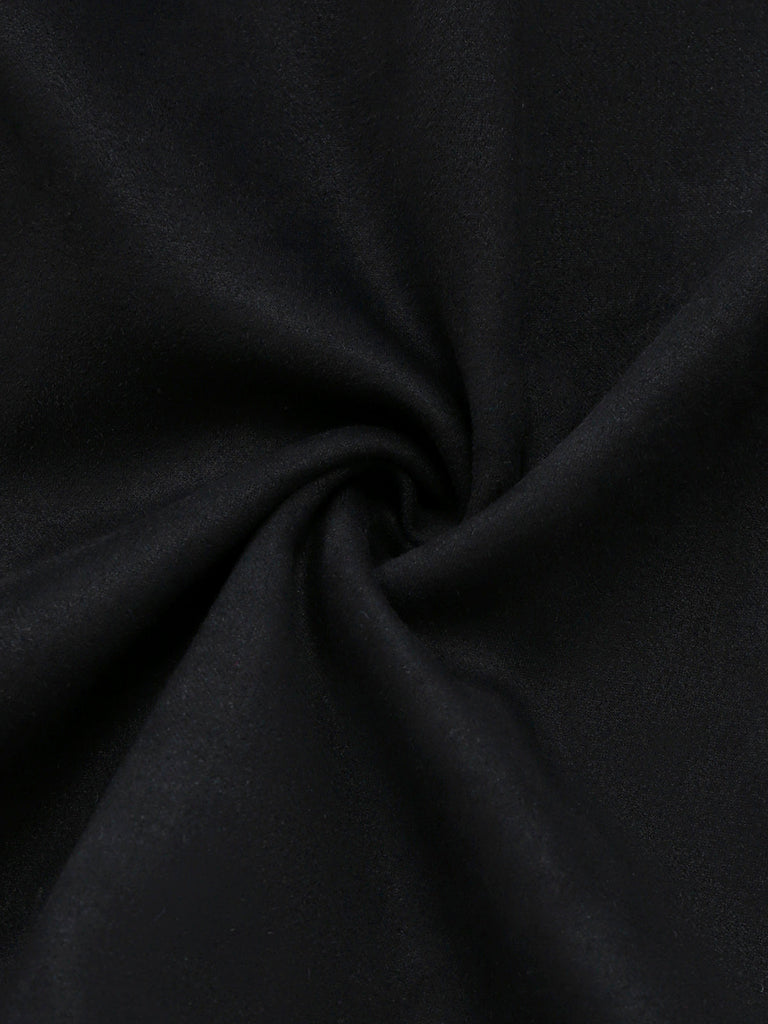 Manteau long noire à bordure en fausse fourrure années 1930