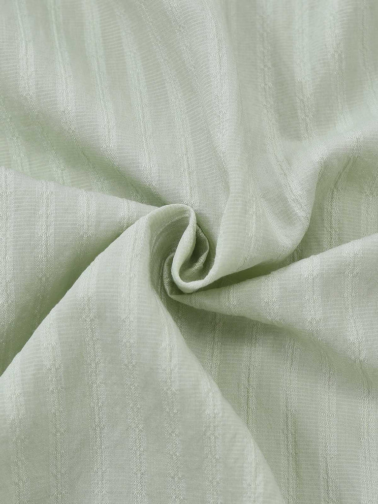 Chemisier vert col noué et manches bouffantes des années 80