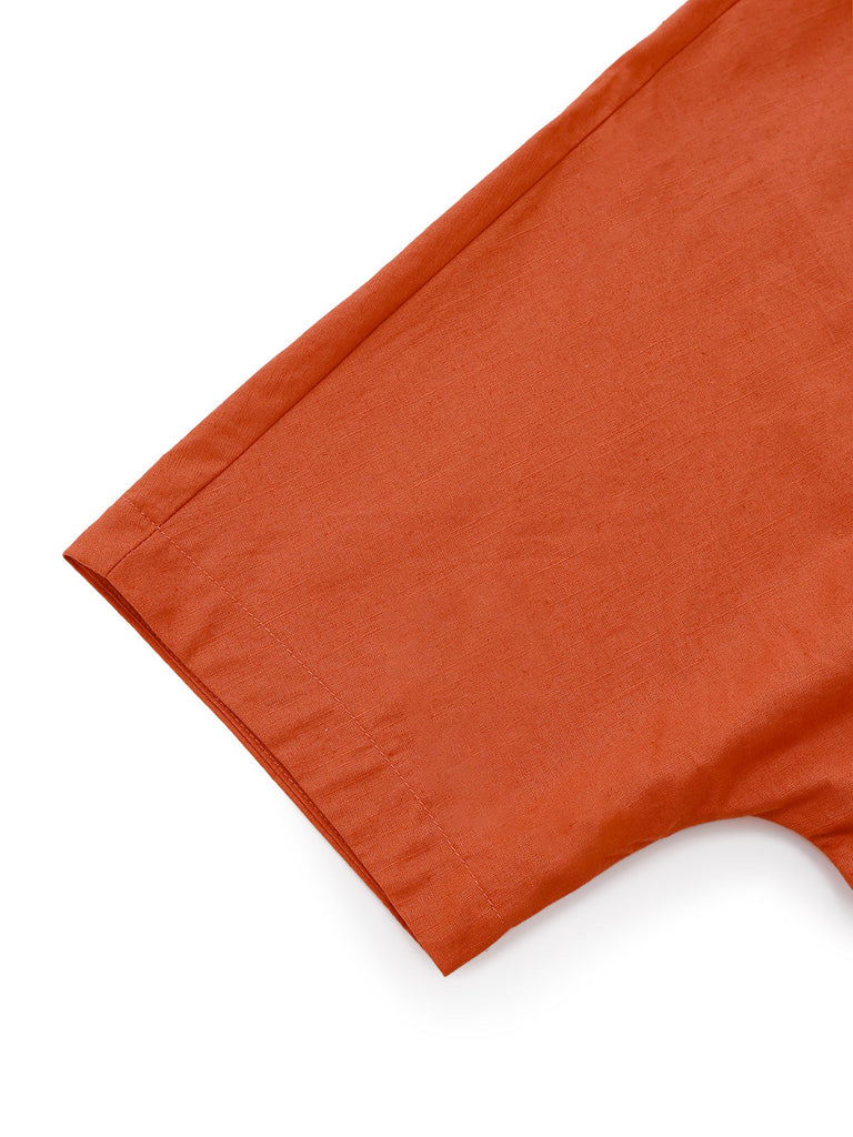 Robe unie orange à col en V et boutons et broche années 1940