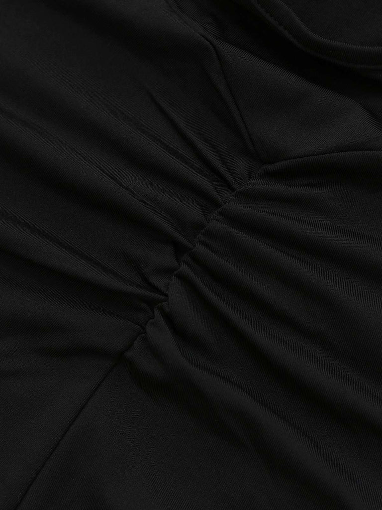 Combinaison évasée noire sans bretelles patchwork en dentelle des années 1970