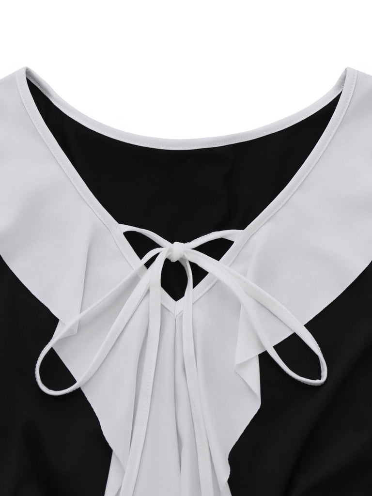 Robe péplum à volants noire et blanche années 1960