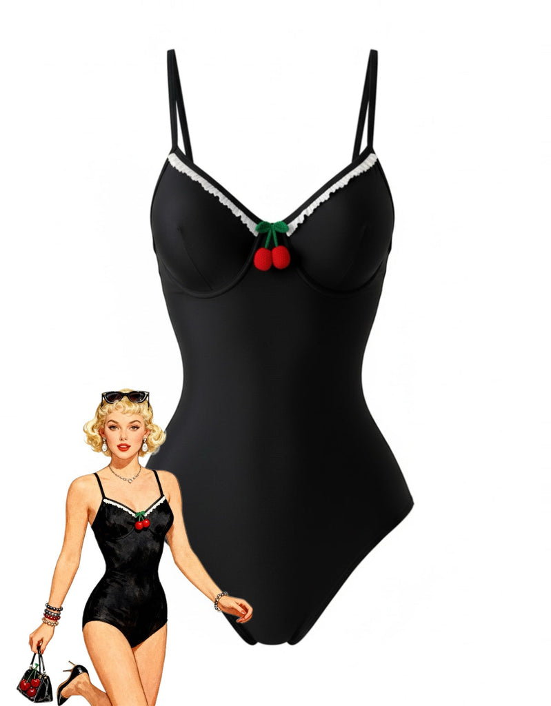 Un maillot de bain une pièce noir classique, doté d'un décolleté en cœur orné d'une bordure festonnée blanche et d'une application décorative en forme de cerise, présenté avec une illustration de mode rétro.