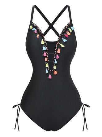 Un maillot de bain une pièce noir doté d'un décolleté en V profond orné de pompons colorés et de détails à nouer sur les côtés.