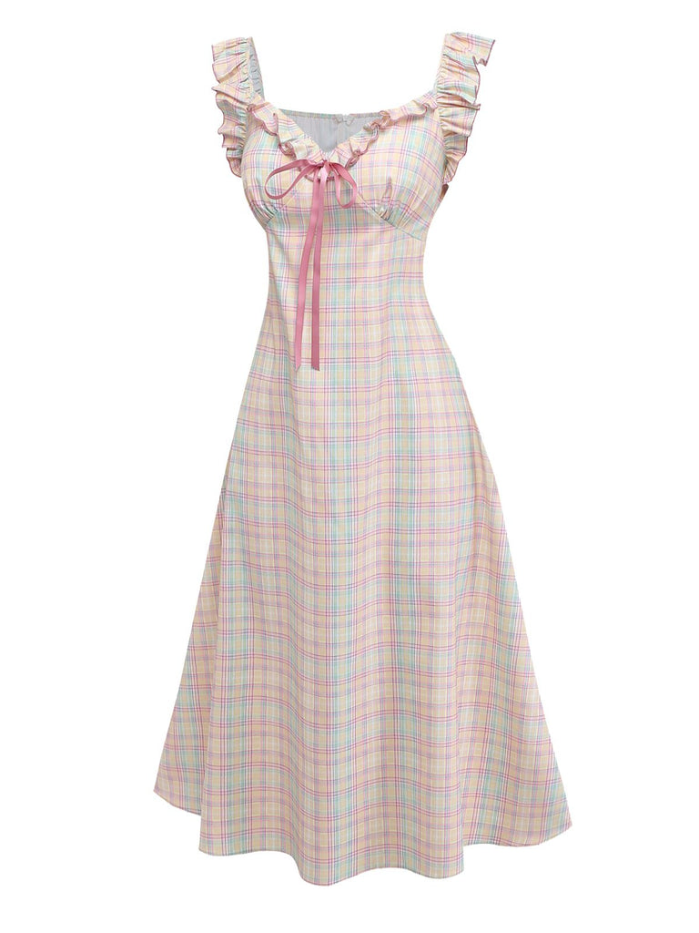Pastel plaid swing dress with ruffled bow details and sweetheart neckline for 1950s vintage styling