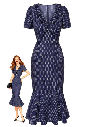 Robe bleu marine à pois portée par un mannequin sur fond blanc
