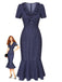 Robe bleu marine à pois portée par un mannequin sur fond blanc