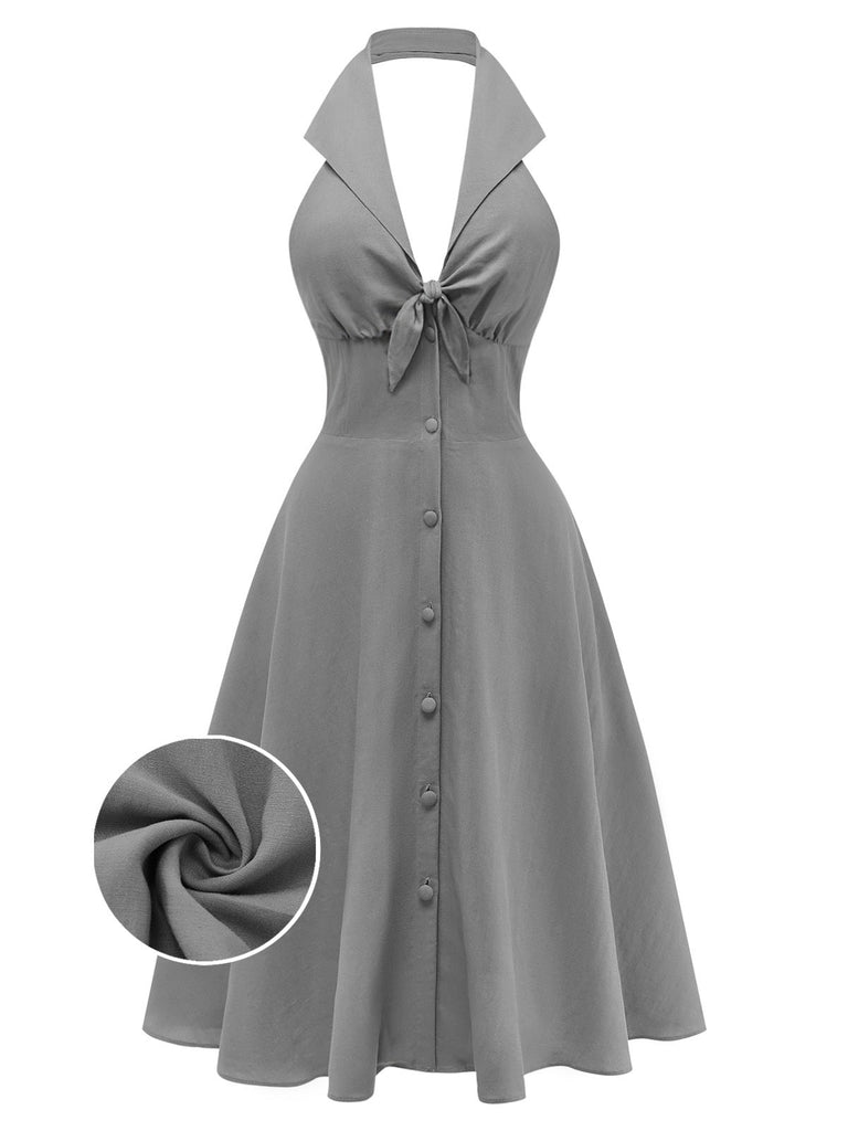Robe dos nu grise vue de face mettant en valeur un décolleté élégant pour les occasions estivales décontractées