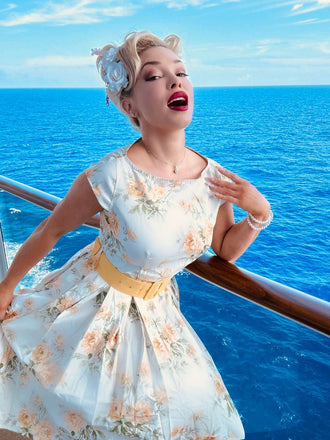 Robe jaune à fleurs antique col bateau ceinturée années 1950