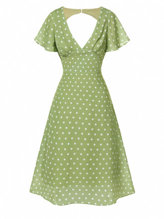 Robe verte à pois ajourés dans le dos des années 40