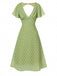 Robe verte à pois ajourés dans le dos des années 40