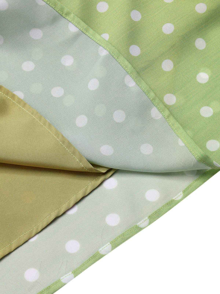 Robe verte à pois ajourés dans le dos des années 40