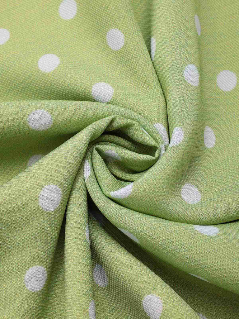 Robe verte à pois ajourés dans le dos des années 40