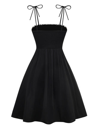 Robe noire à bretelles en nœud texturées et florales des années 1950