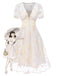 Robe blanche à fleurs brodées col V profond années 1950
