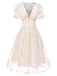 Robe blanche à fleurs brodées col V profond années 1950