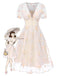 Robe blanche à fleurs brodées col V profond années 1950