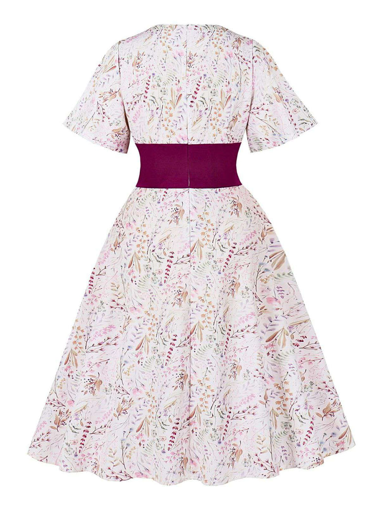 Robe fleurie manches cloche et décolleté en cœur Rose Viole des années 1950