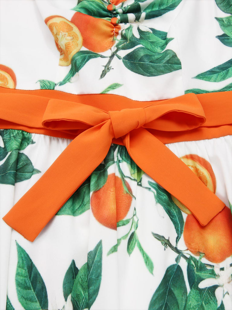 Robe orange à bretelles et nœud à la taille années 1950