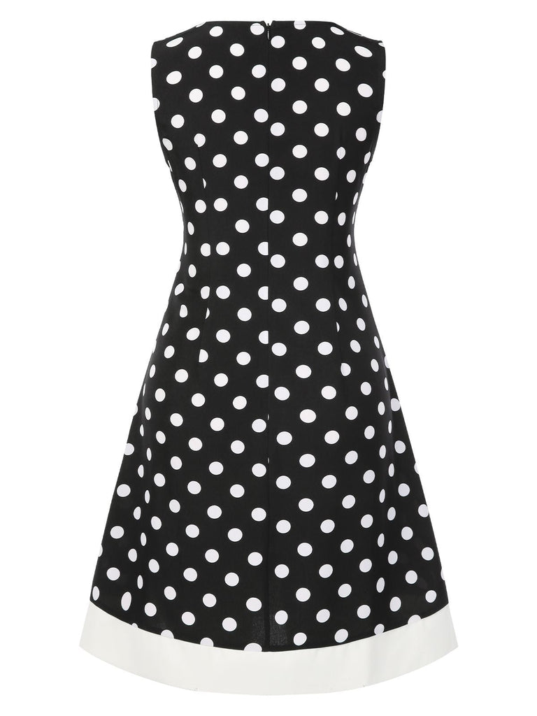 Robe noire à pois et col en V des années 1960