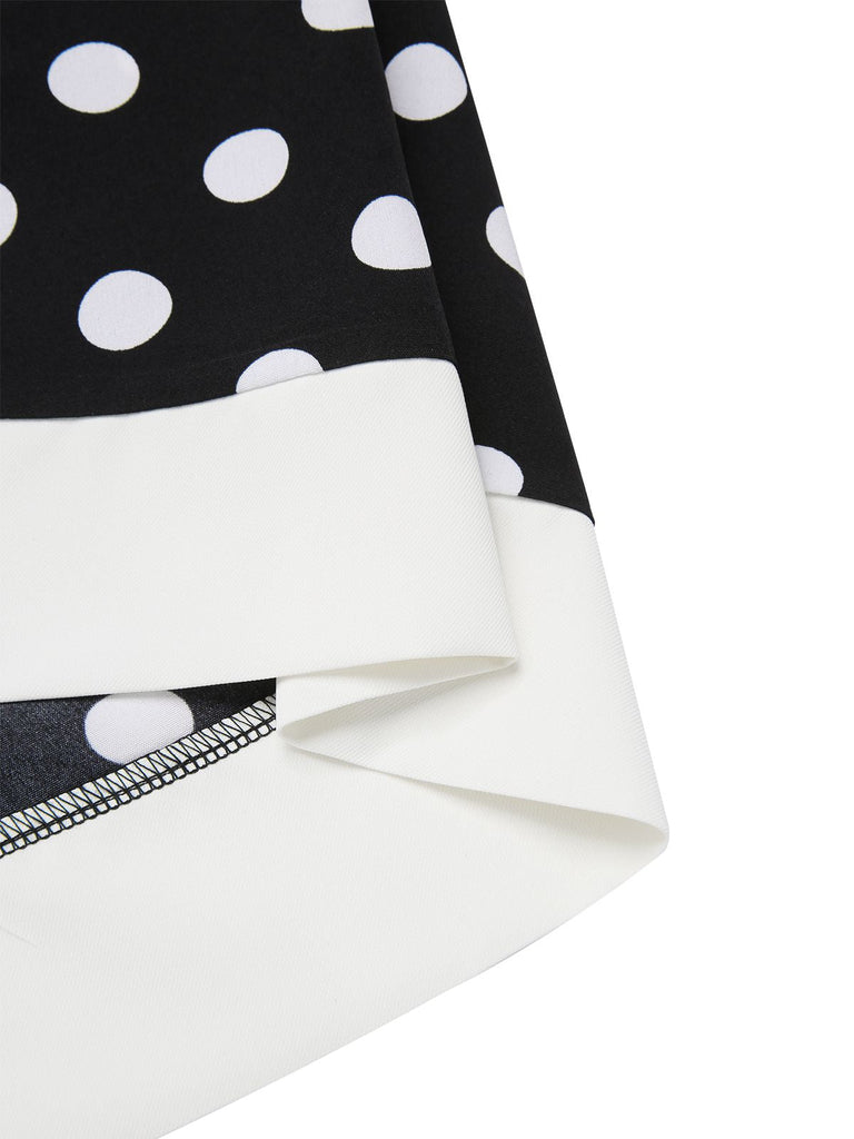 Robe noire à pois et col en V des années 1960