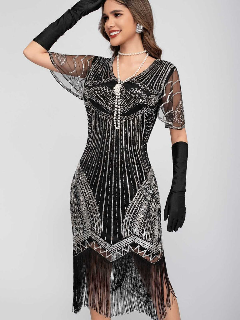 Robe Charleston à paillettes et pompons col rond années 1920