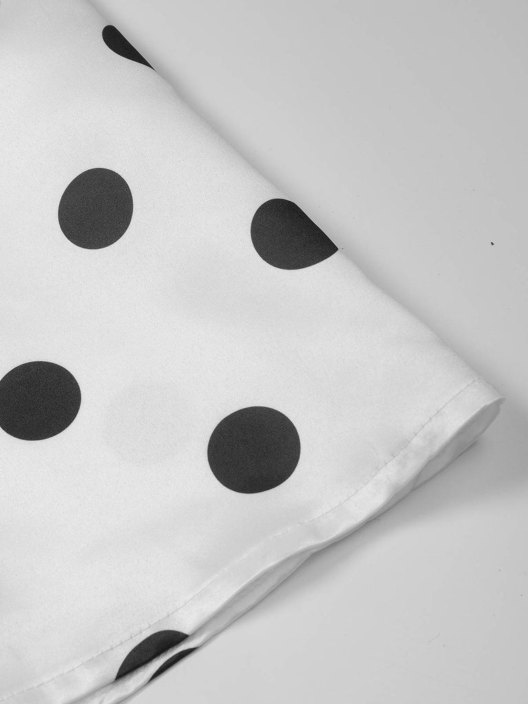 Robe cache-cœur à pois ceinturée et col en V années 1950