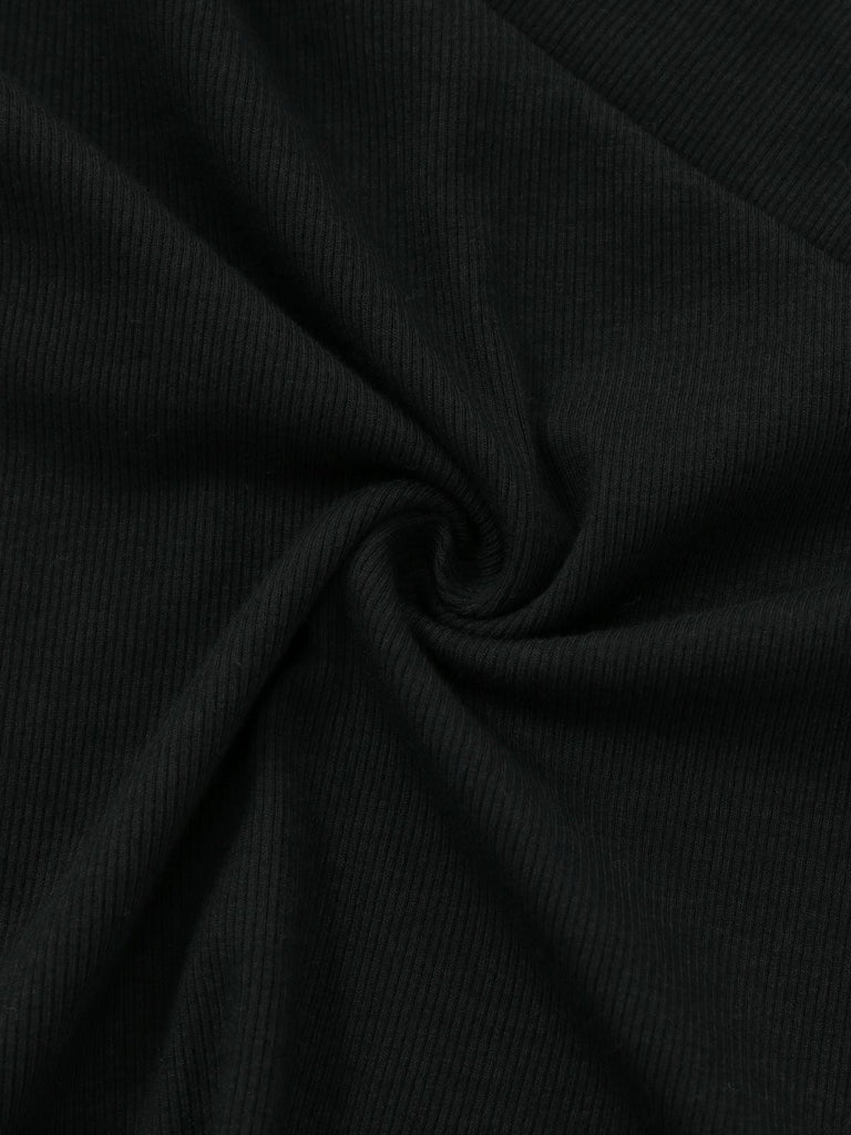 Haut tricoté noir col en V et manches lanternes style années 1950