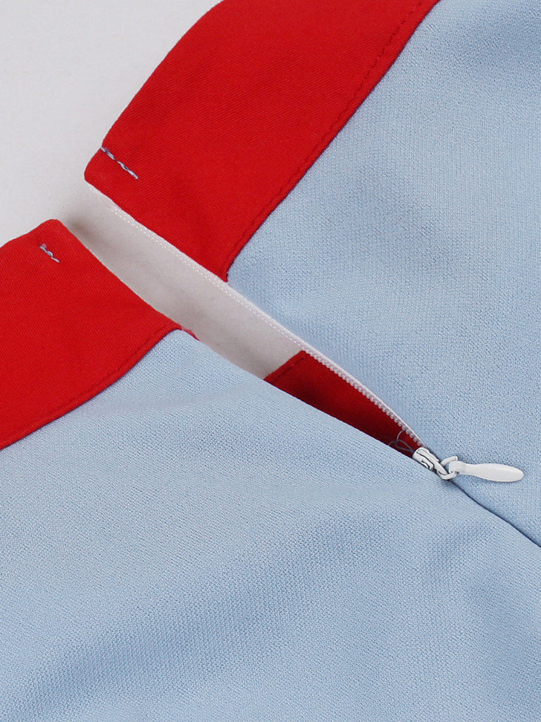 Robe bleue col montant et nœud contrastant années 1950