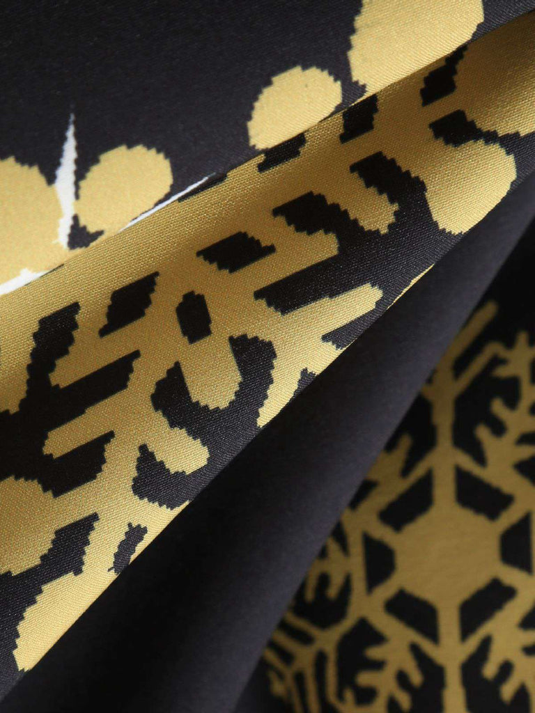 Robe noire à ceinture ruban flocon de neige années 1950