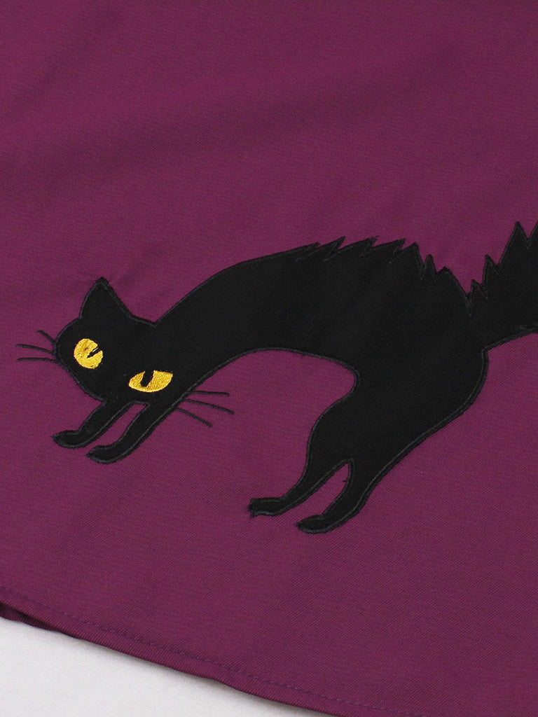 Robe trapèze motif chat larges bretelles rouge violacé des années 1950