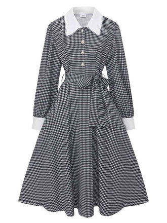 Robe noire à manches bouffantes et boutons nacrés style pied-de-poule années 1940