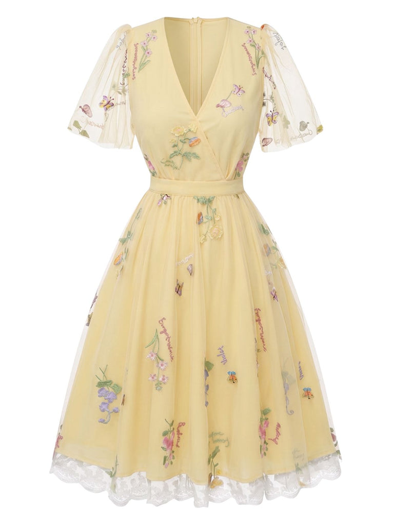 Robe verte manches bouffantes et broderies florales en résille années 50
