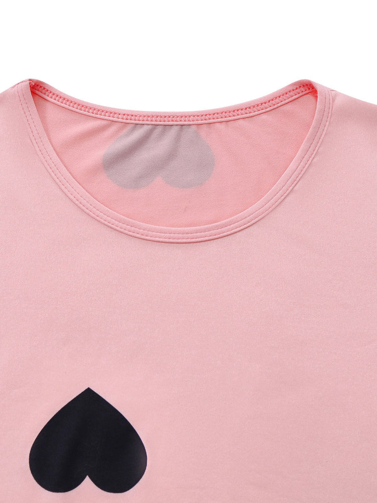 Robe moulante rose à col rond et motif cœur années 60