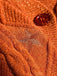 Gilet orange à col en V et broderie d'étoiles années 1940