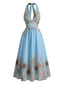 Robe Swing col V et dos nu motif tournesols et taille cintrée années 1950