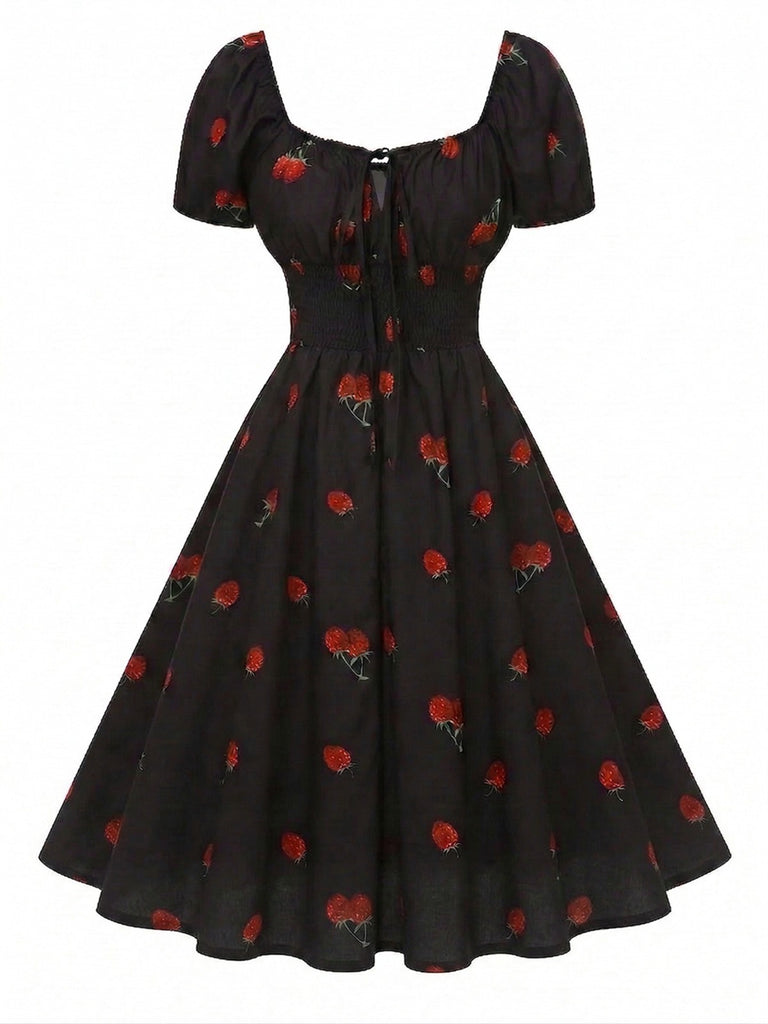 Robe noire imprimé cerises manches bouffantes années 1950