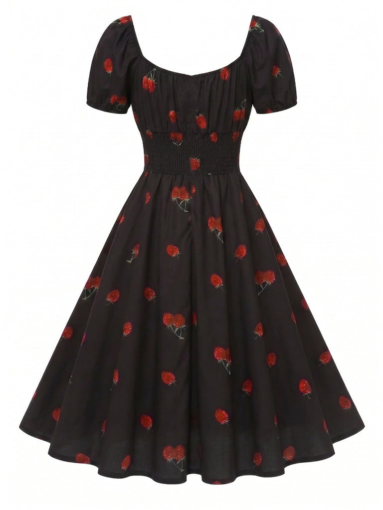 Robe noire imprimé cerises manches bouffantes années 1950